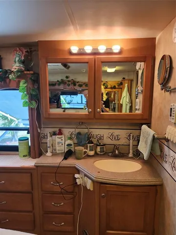 a bathroom with a sink and a mirror