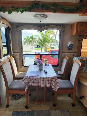 a view of a dining room with furniture window and outside view