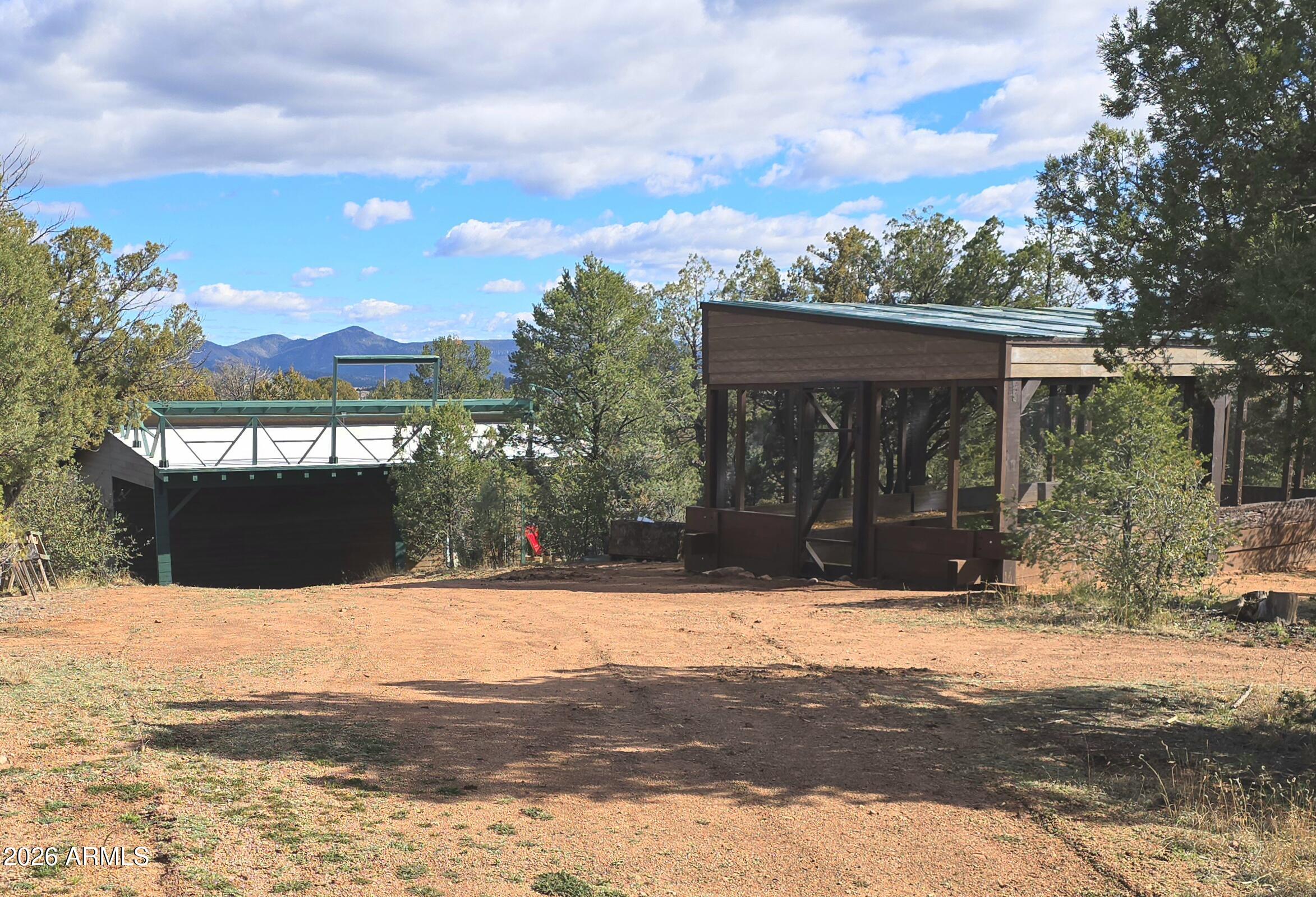 84 Mail Trail Road Young, AZ 85554 - Photo 34 of 57 a view of swimming pool with a bench in front of house