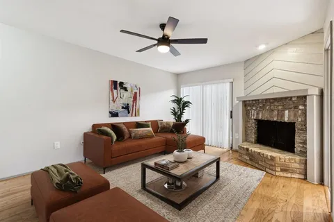 a living room with furniture a fireplace