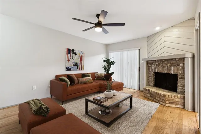 a living room with furniture a fireplace