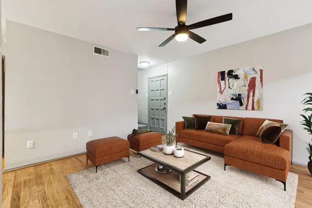a living room with furniture and a rug