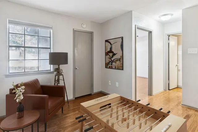 a bedroom with furniture and a window