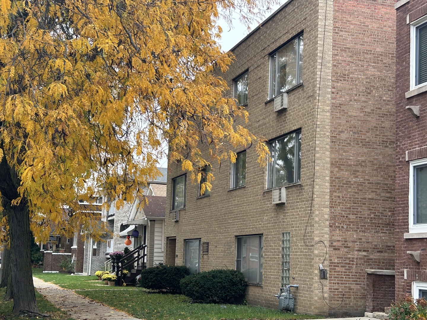 2825 Ridgeland Avenue, Unit 10 Berwyn, IL 60402 - Photo 3 of 10 front view of a brick house with a yard and large trees