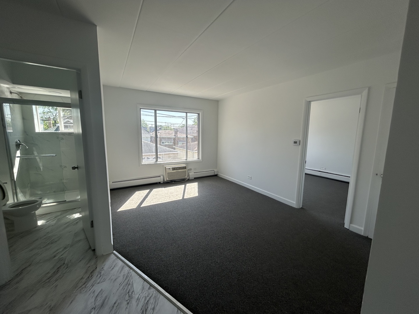 2825 Ridgeland Avenue, Unit 10 Berwyn, IL 60402 - Photo 5 of 10 an empty room with windows
