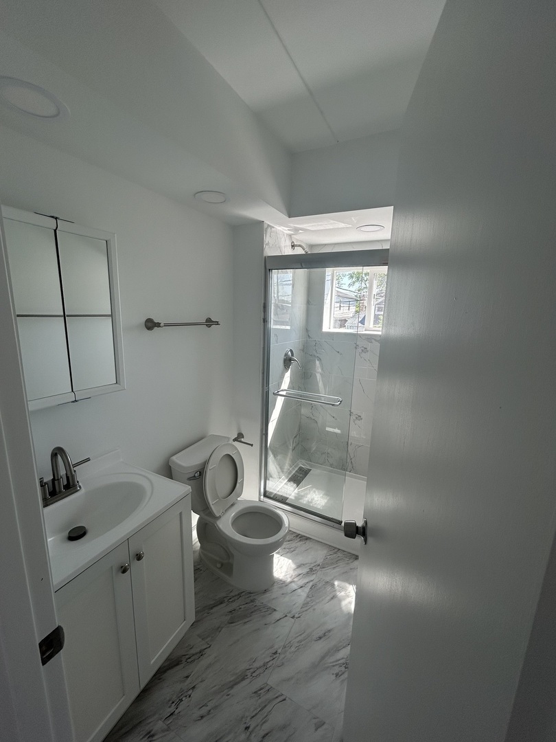 2825 Ridgeland Avenue, Unit 10 Berwyn, IL 60402 - Photo 6 of 10 a bathroom with a sink a toilet and view