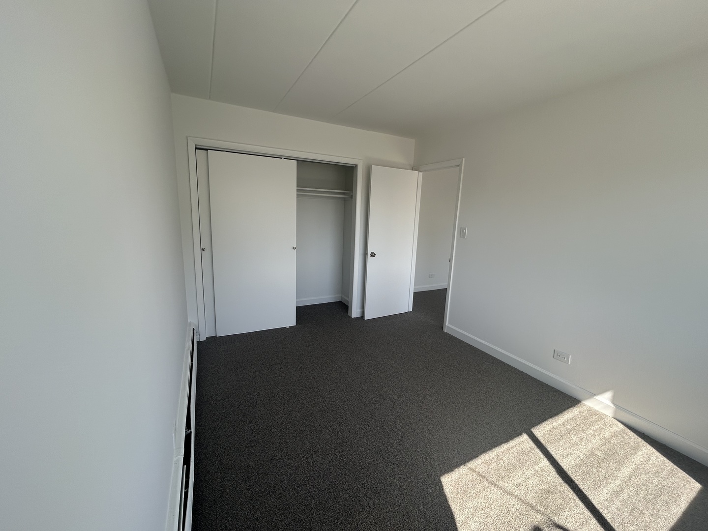 2825 Ridgeland Avenue, Unit 10 Berwyn, IL 60402 - Photo 7 of 10 an empty room with a bench