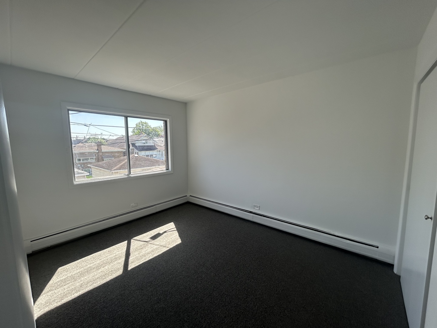 2825 Ridgeland Avenue, Unit 10 Berwyn, IL 60402 - Photo 8 of 10 an empty room with windows