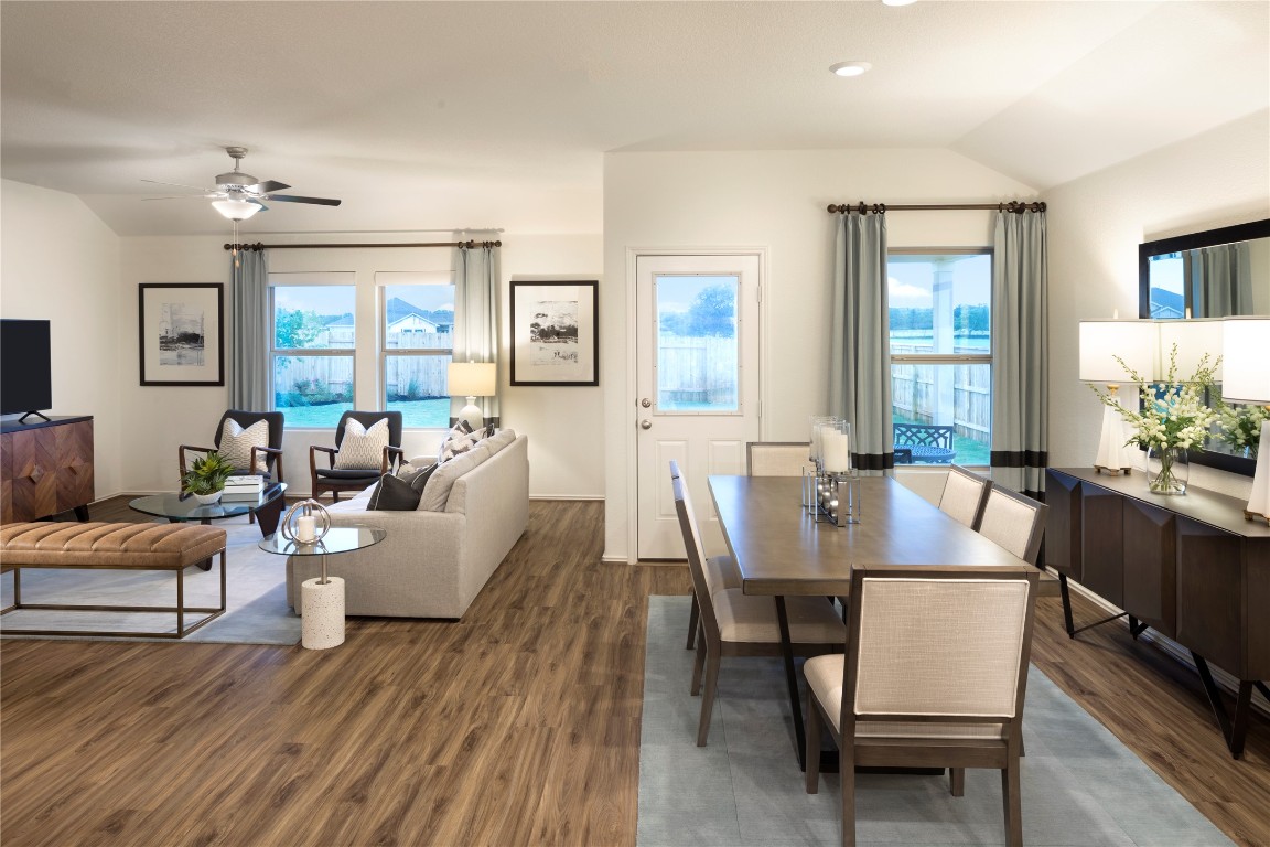 1121 Nesting Bird Drive Georgetown, TX 78628 - Photo 4 of 10 a dining room with furniture a chandelier and wooden floor
