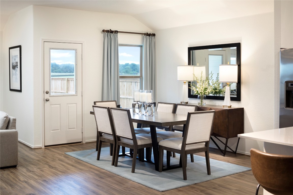 1121 Nesting Bird Drive Georgetown, TX 78628 - Photo 6 of 10 a dining room with furniture and wooden floor