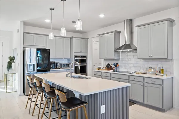a kitchen with counter top space cabinets and stainless steel appliances