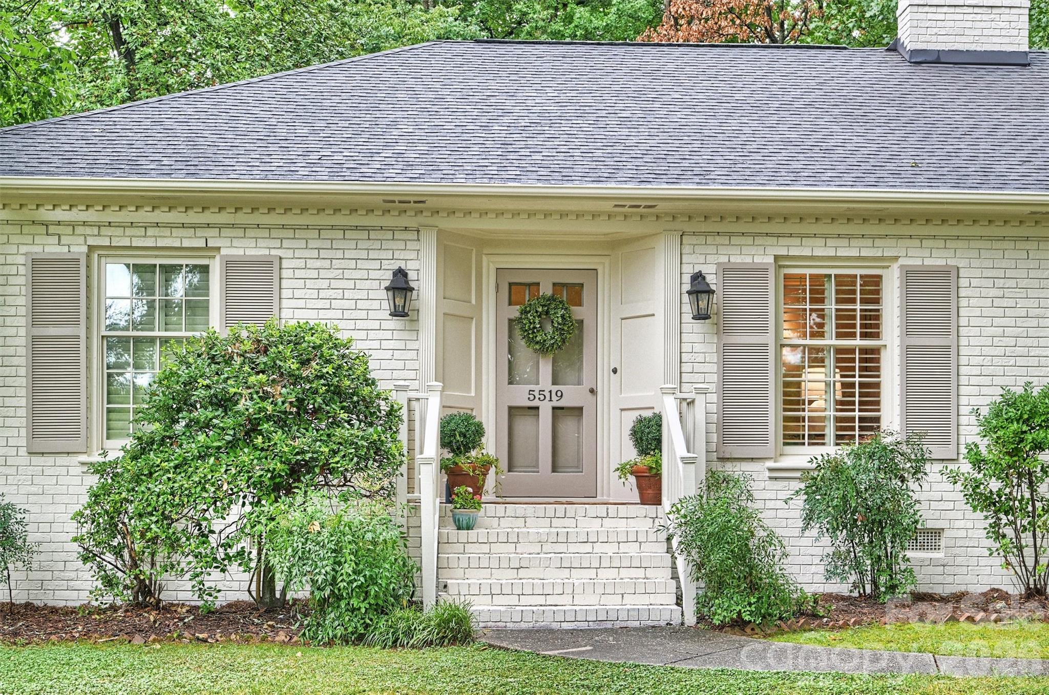 5519 Robinhood Road Charlotte, NC 28211 - Photo 2 of 46 a front view of a house with a yard