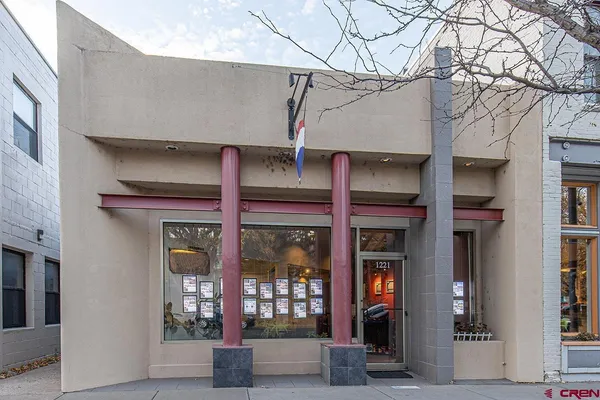a view of brick building with a large windows