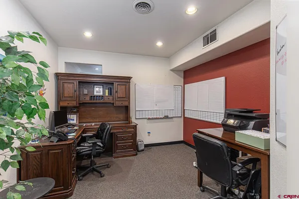a kitchen that has a lot of cabinets a sink and a stove in it