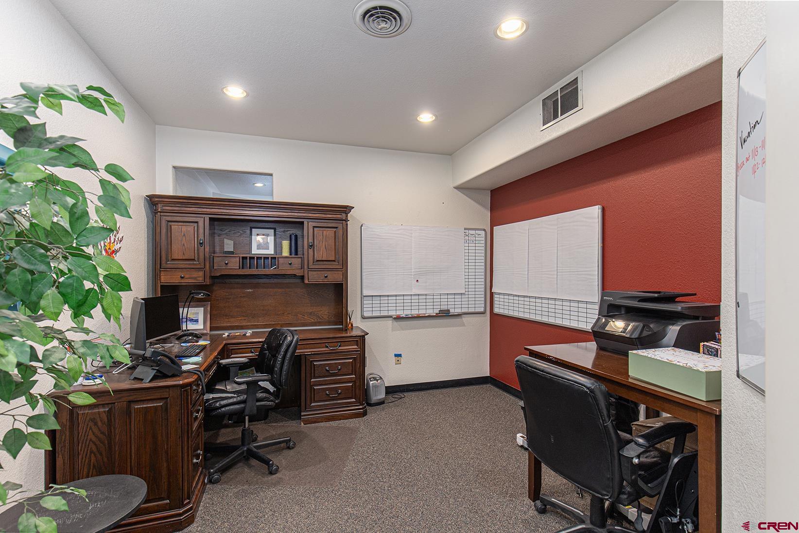 1221 Main Avenue Durango, CO 81301 - Photo 11 of 31 a kitchen that has a lot of cabinets a sink and a stove in it