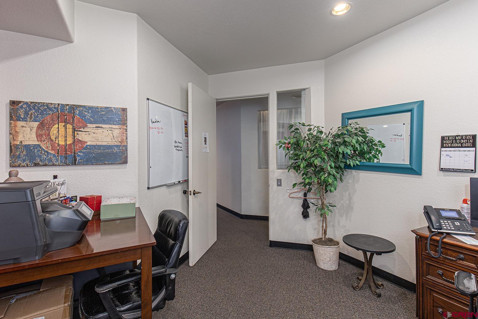 1221 Main Avenue Durango, CO 81301 - Photo 12 of 31 a view of a workspace with furniture and a potted plant