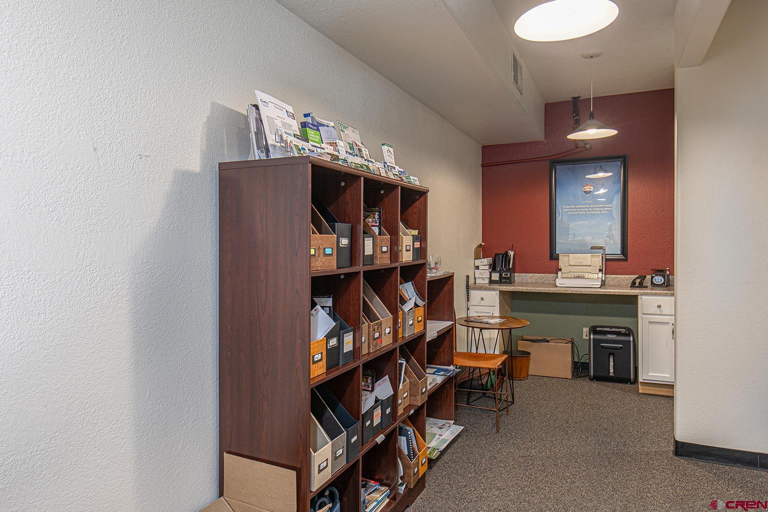 1221 Main Avenue Durango, CO 81301 - Photo 18 of 31 a room with furniture and a chandelier