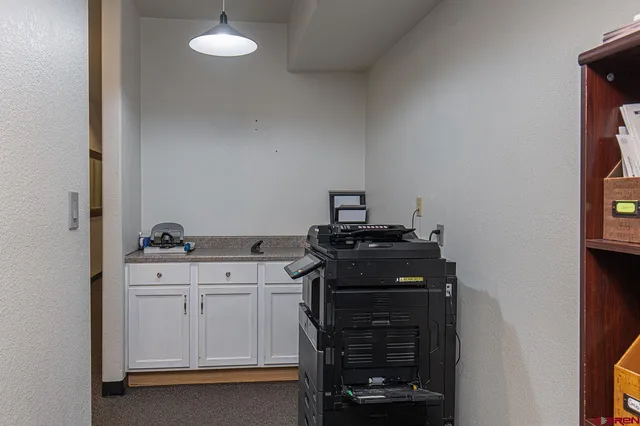 a kitchen with a stove and cabinets