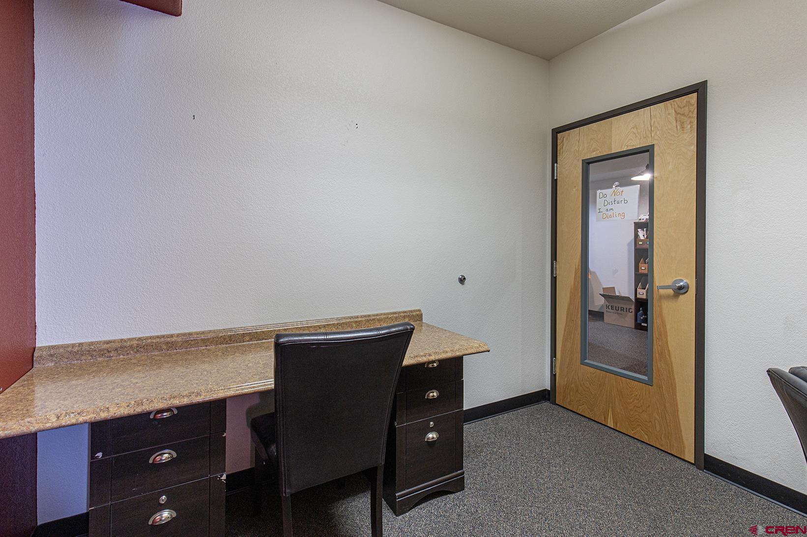 1221 Main Avenue Durango, CO 81301 - Photo 21 of 31 a room with a table and a chair