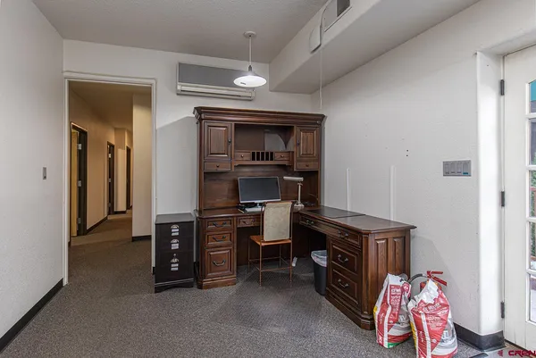 a view of a workspace with furniture