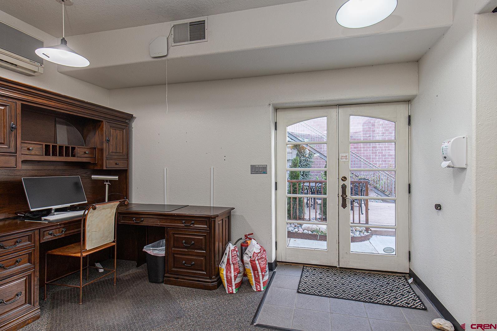 1221 Main Avenue Durango, CO 81301 - Photo 23 of 31 a room with furniture and a window