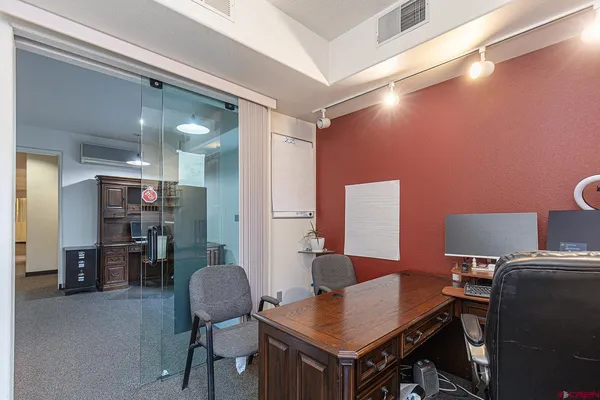 a workspace with furniture and bathroom