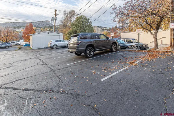 a view of a car parked in front of a house