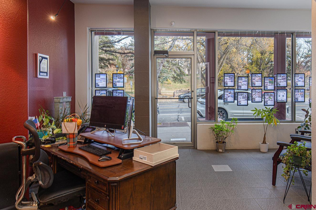 1221 Main Avenue Durango, CO 81301 - Photo 3 of 31 a view of a workspace with furniture and a potted plant