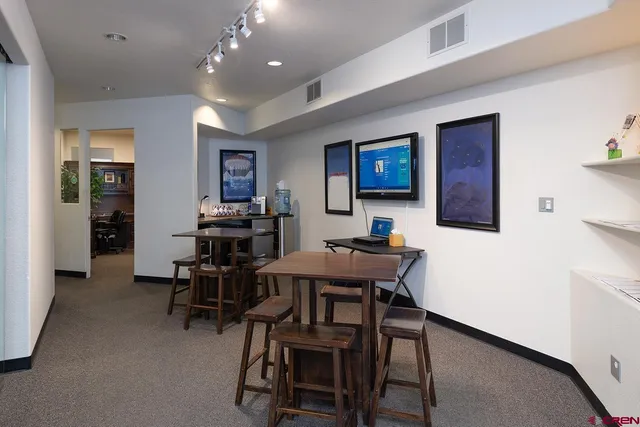 a view of a dining room with furniture