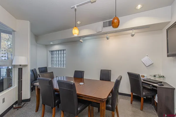 a view of a dining room with furniture
