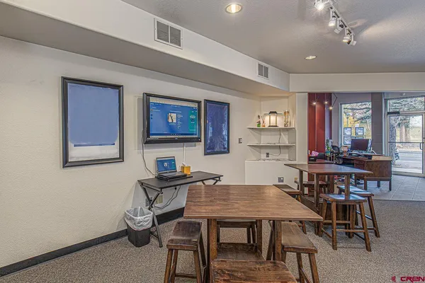 a view of a dining room with furniture