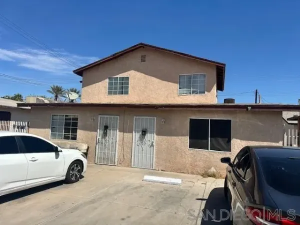 a view of a car parked in front of a house