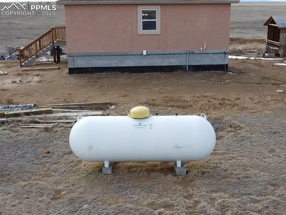 32174 Torrence Road Yoder, CO 80864 - Photo 15 of 27 a view of a backyard of the house