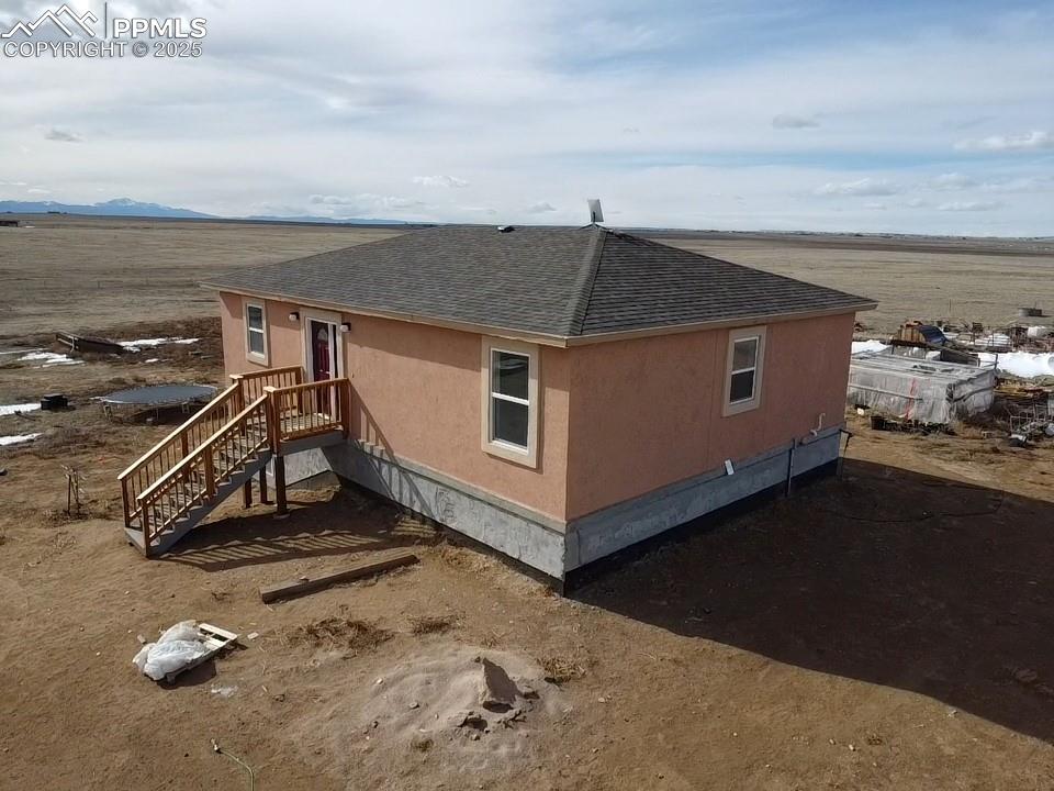 32174 Torrence Road Yoder, CO 80864 - Photo 17 of 27 a view of a room with wooden floor