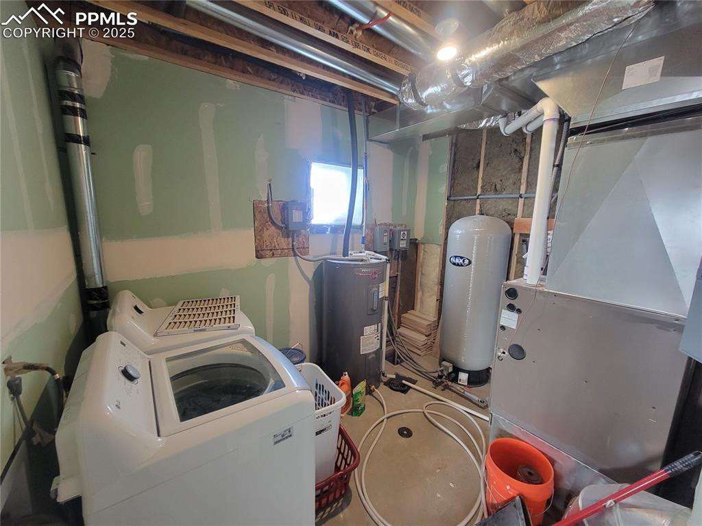 32174 Torrence Road Yoder, CO 80864 - Photo 25 of 27 a utility room with dryer and washer