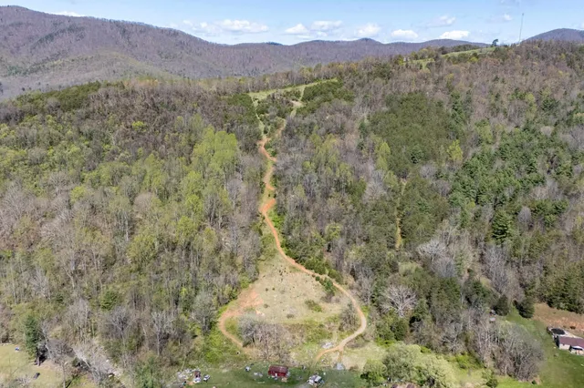a view of a town with mountains in the background