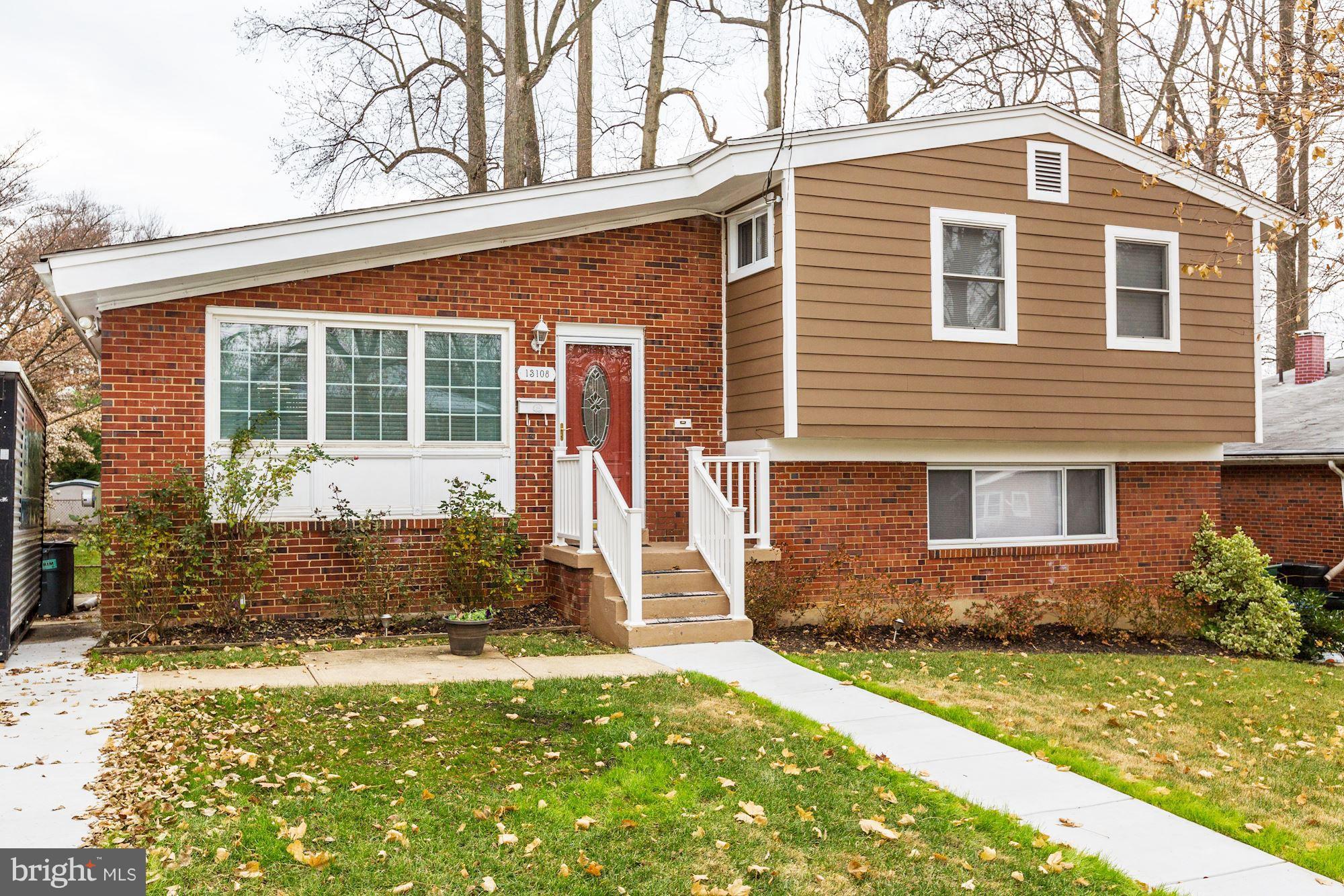 13108 Holdridge Road Silver Spring, MD 20906 - Photo 1 of 30 a front view of a house with garden
