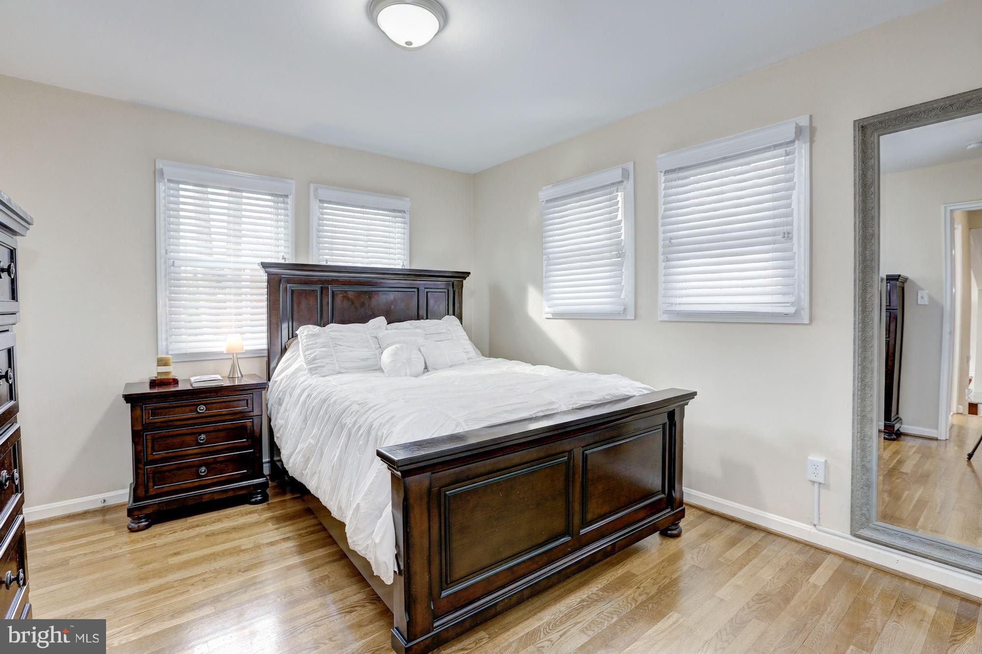 13108 Holdridge Road Silver Spring, MD 20906 - Photo 12 of 30 a bed sitting in a bedroom next to a window