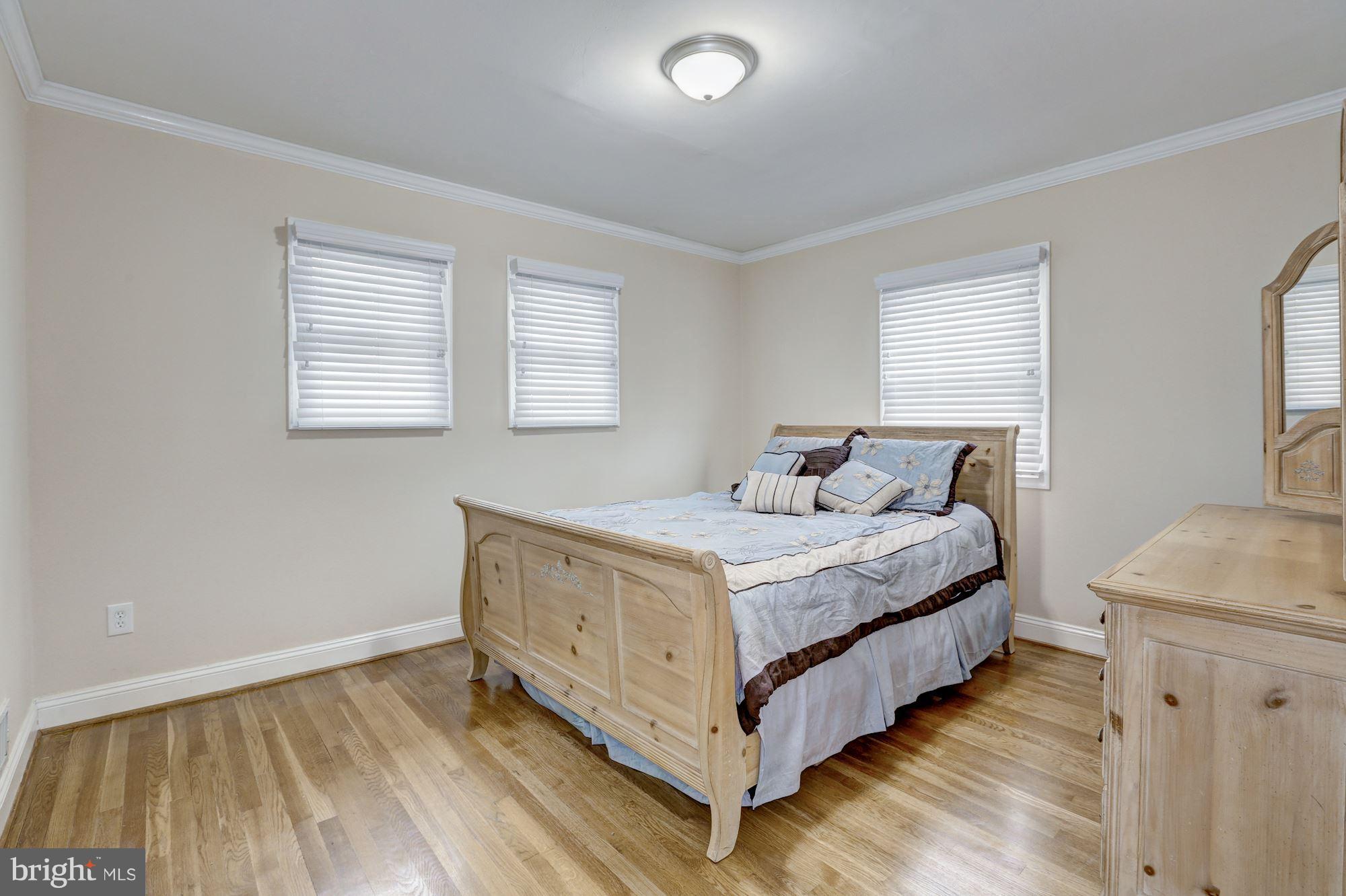 13108 Holdridge Road Silver Spring, MD 20906 - Photo 14 of 30 a bedroom with a bed and a table