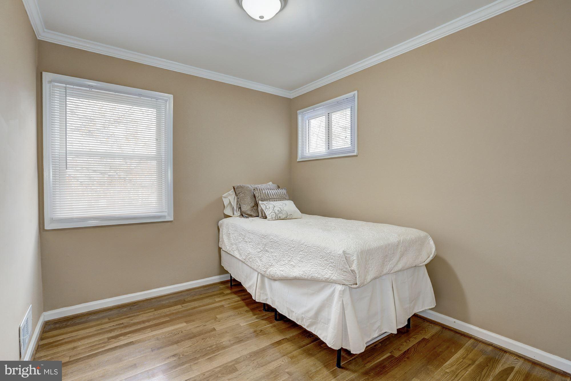 13108 Holdridge Road Silver Spring, MD 20906 - Photo 15 of 30 a bedroom with a bed and a window