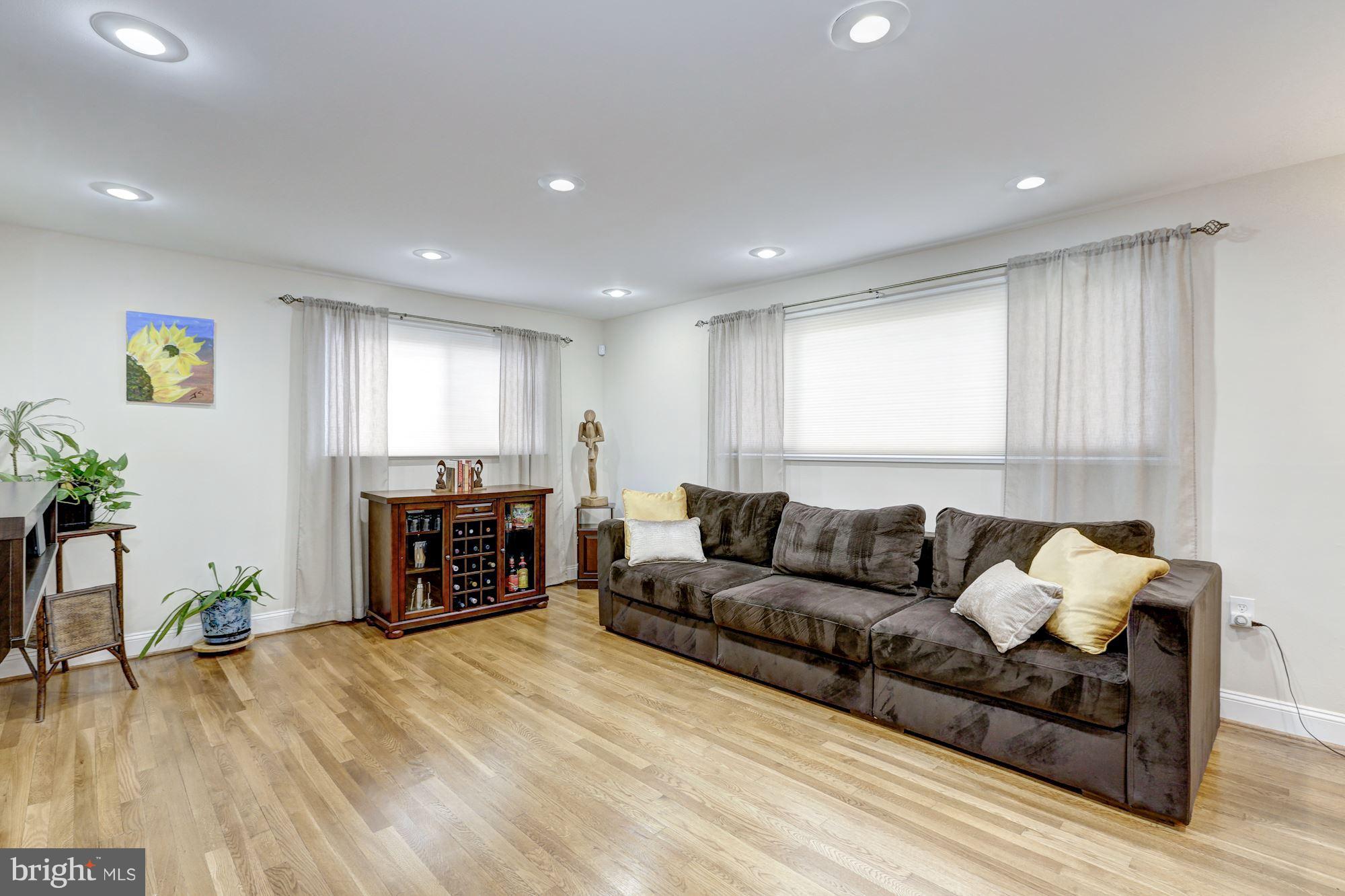 13108 Holdridge Road Silver Spring, MD 20906 - Photo 17 of 30 a living room with furniture and a fireplace