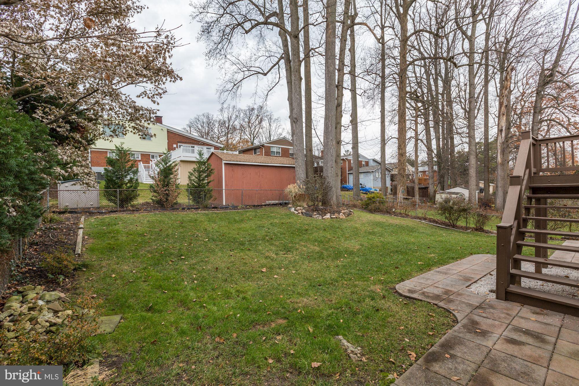13108 Holdridge Road Silver Spring, MD 20906 - Photo 29 of 30 a view of a backyard with large trees