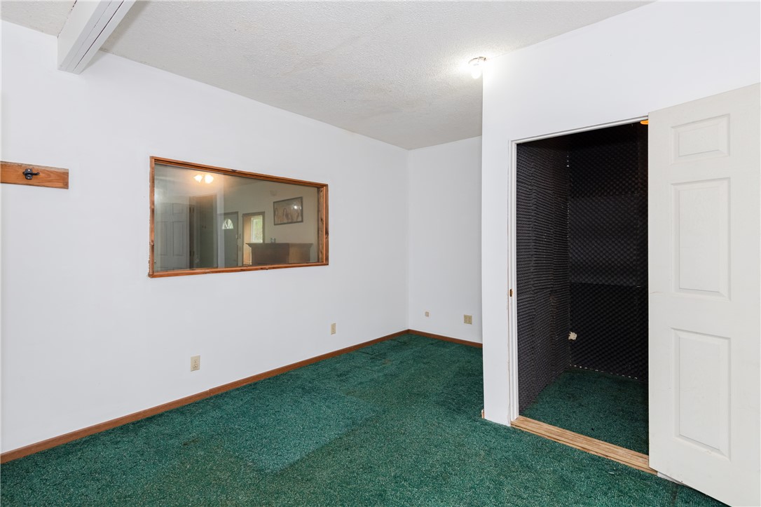 6750 Little Twin Road Germantown, OH 45327 - Photo 55 of 88 This versatile room features plush carpeting and a large interior window, perfect for various uses.