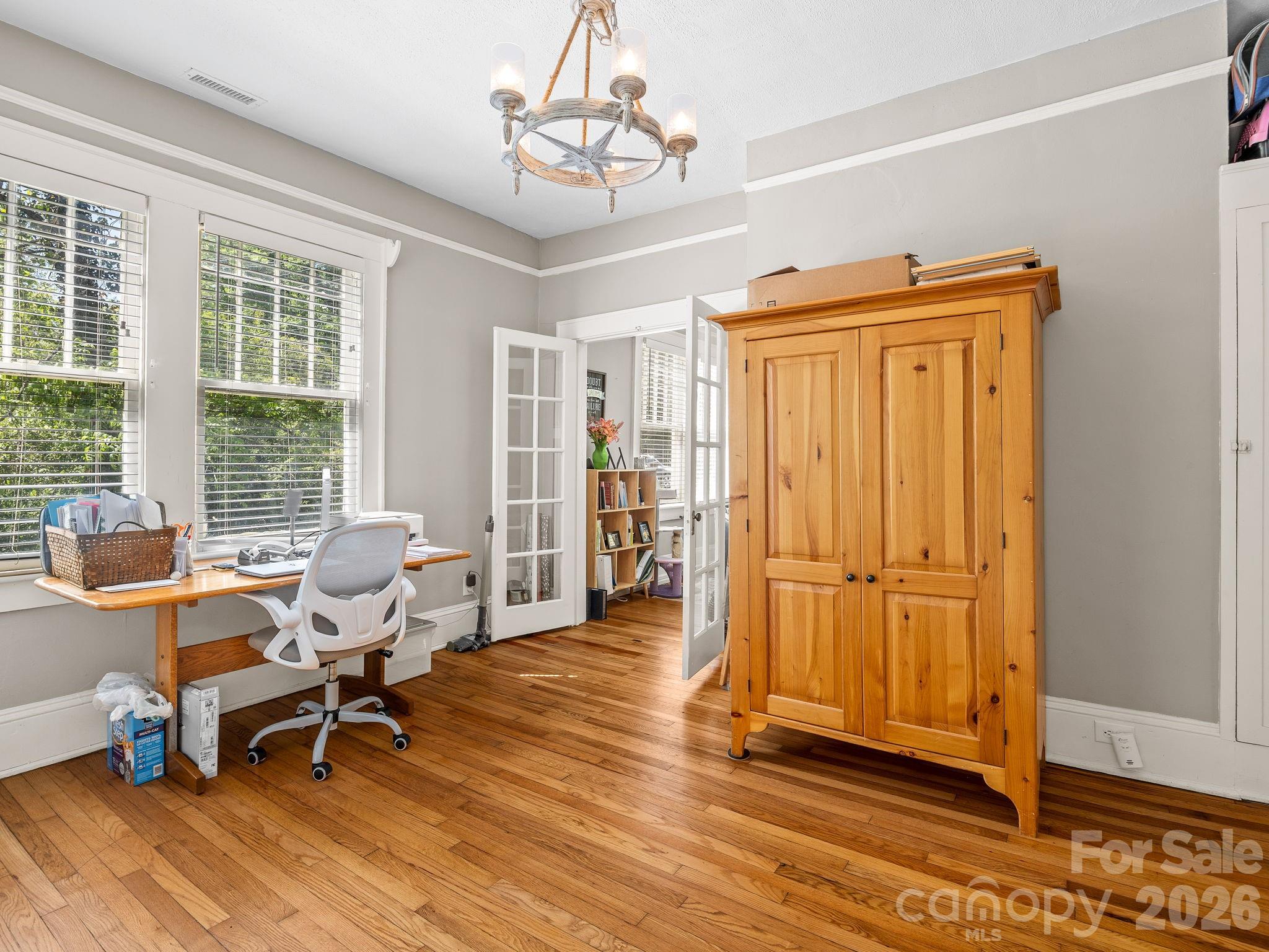 110 Grady Avenue Tryon, NC 28782 - Photo 12 of 41 a living room with furniture a window and wooden floor