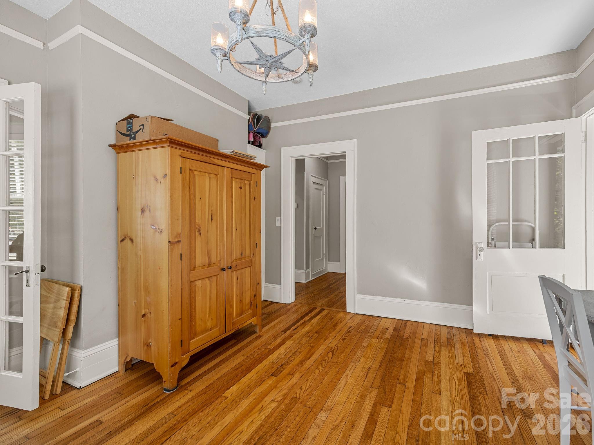 110 Grady Avenue Tryon, NC 28782 - Photo 13 of 41 wooden floor in an empty room with a window
