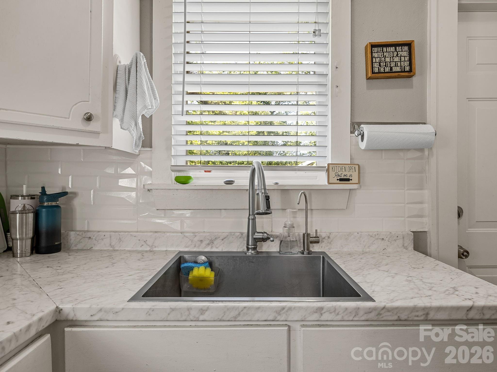110 Grady Avenue Tryon, NC 28782 - Photo 17 of 41 a kitchen with a sink and a window