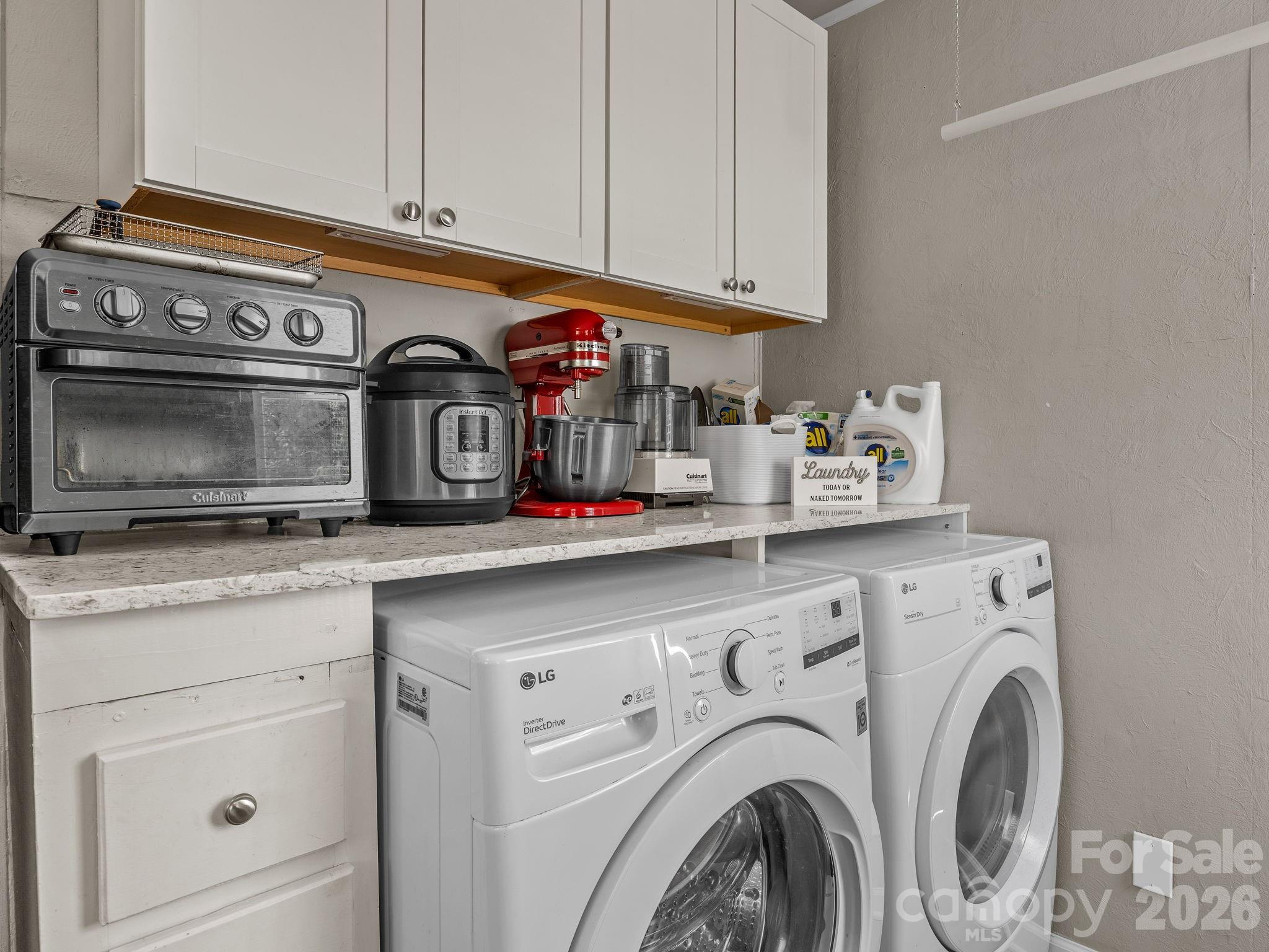 110 Grady Avenue Tryon, NC 28782 - Photo 18 of 41 a utility room with stainless steel appliances granite countertop a sink and a stove