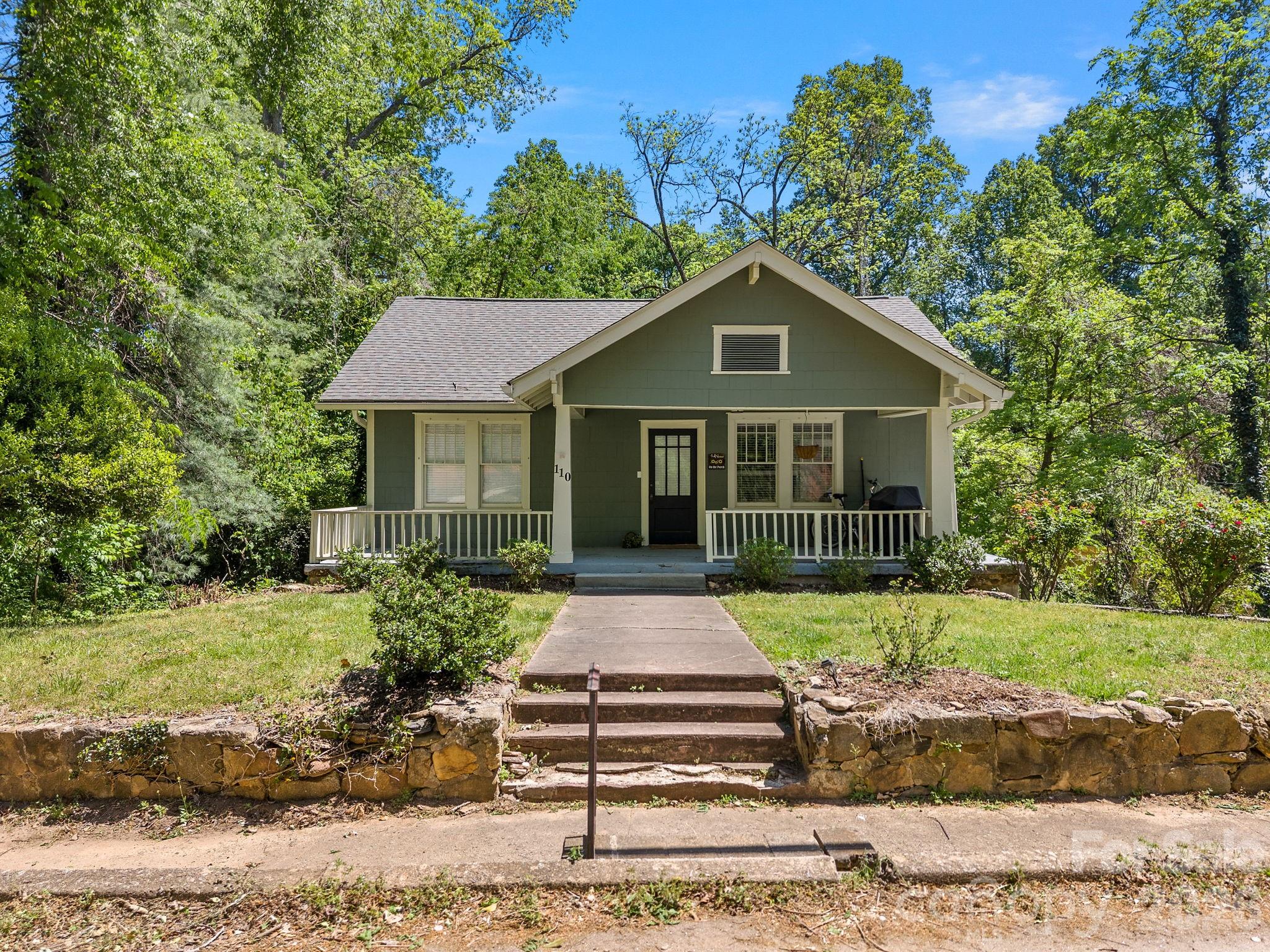 110 Grady Avenue Tryon, NC 28782 - Photo 2 of 41 a front view of a house with a yard