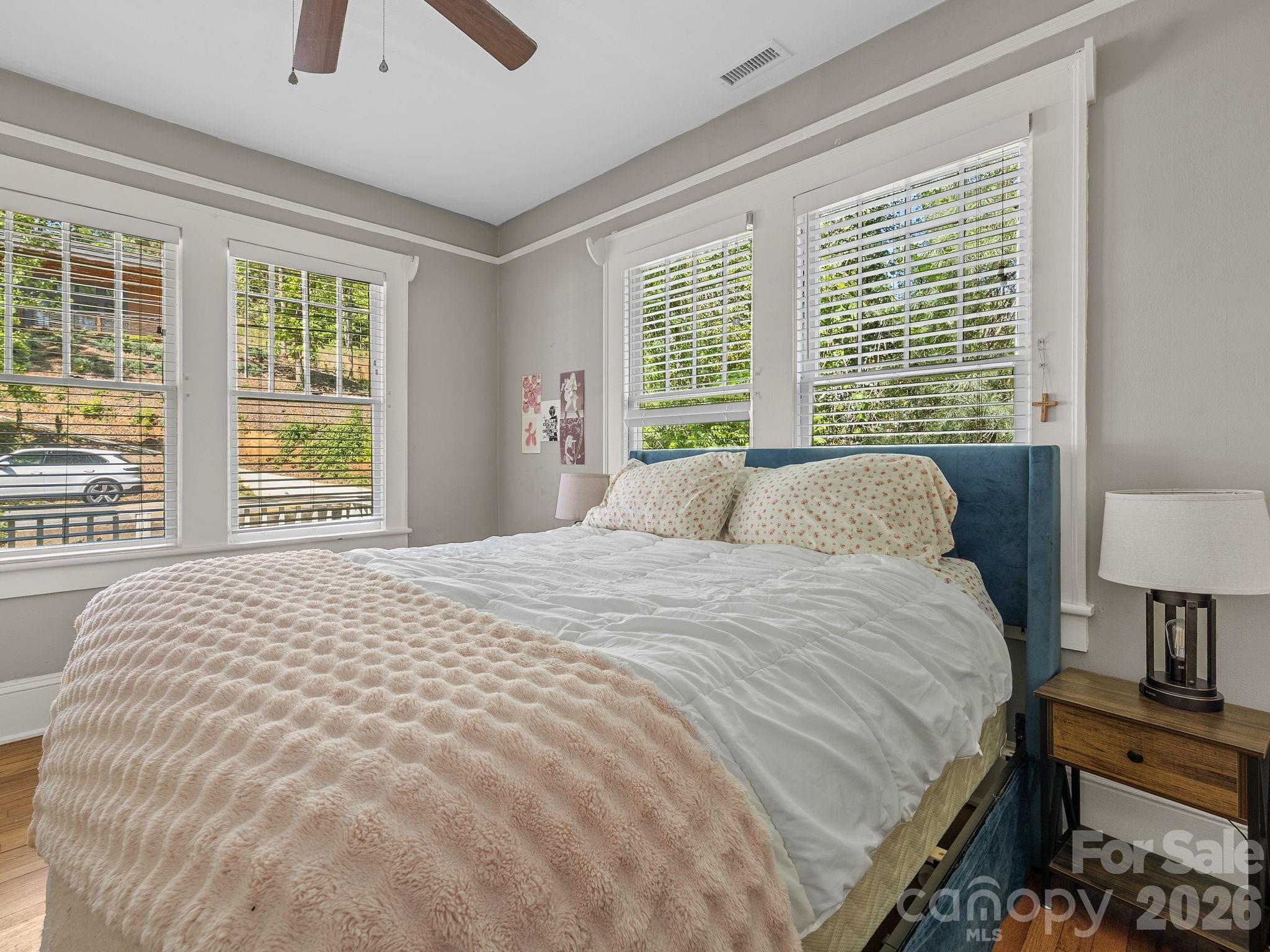 110 Grady Avenue Tryon, NC 28782 - Photo 23 of 41 a large bed sitting in a bedroom next to a window