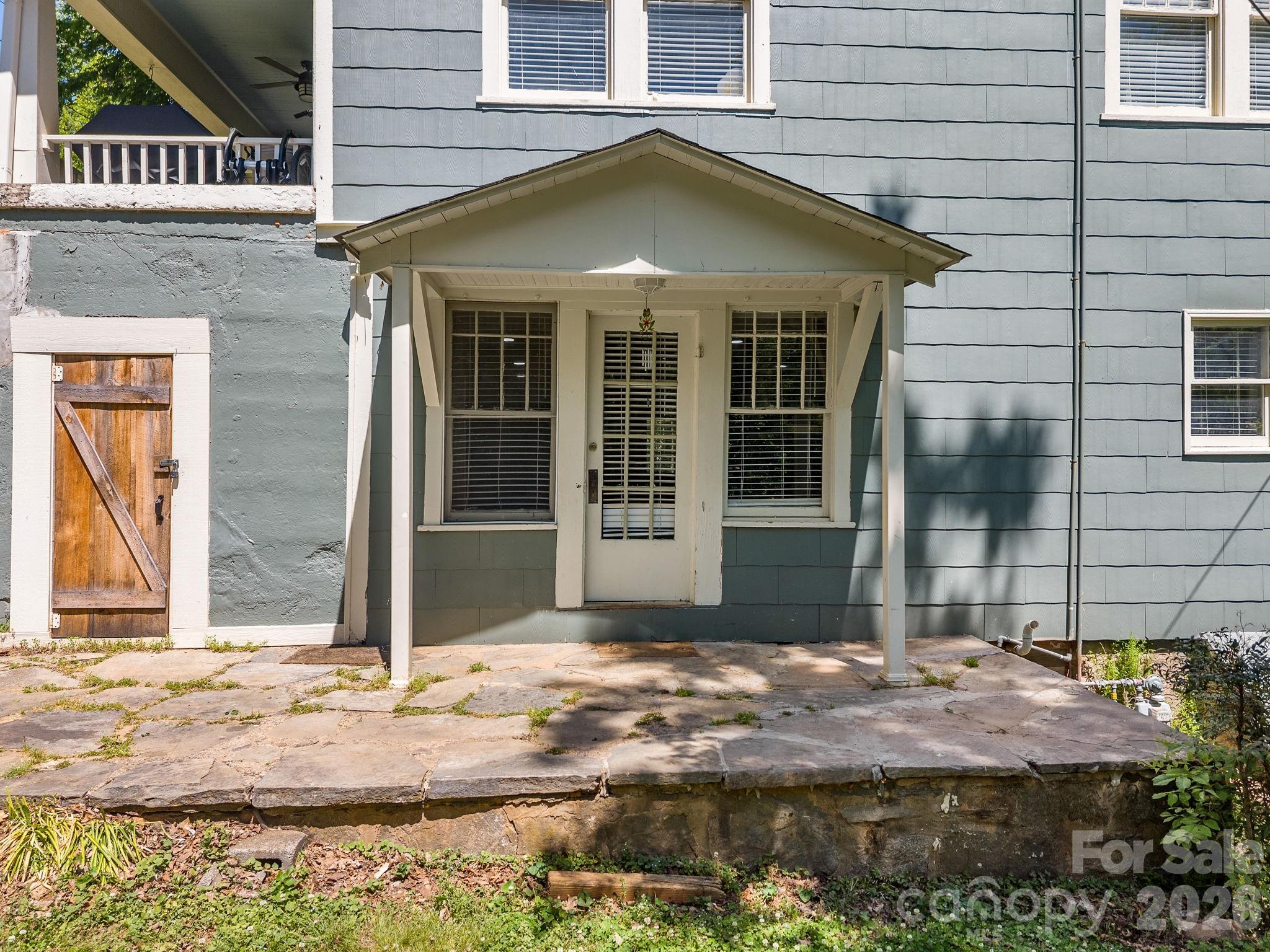 110 Grady Avenue Tryon, NC 28782 - Photo 25 of 41 a front view of a house with a yard